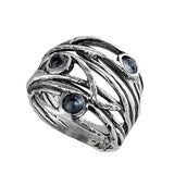 Israeli Intertwining Vines Holding Pools Of Blue Topaz Ring